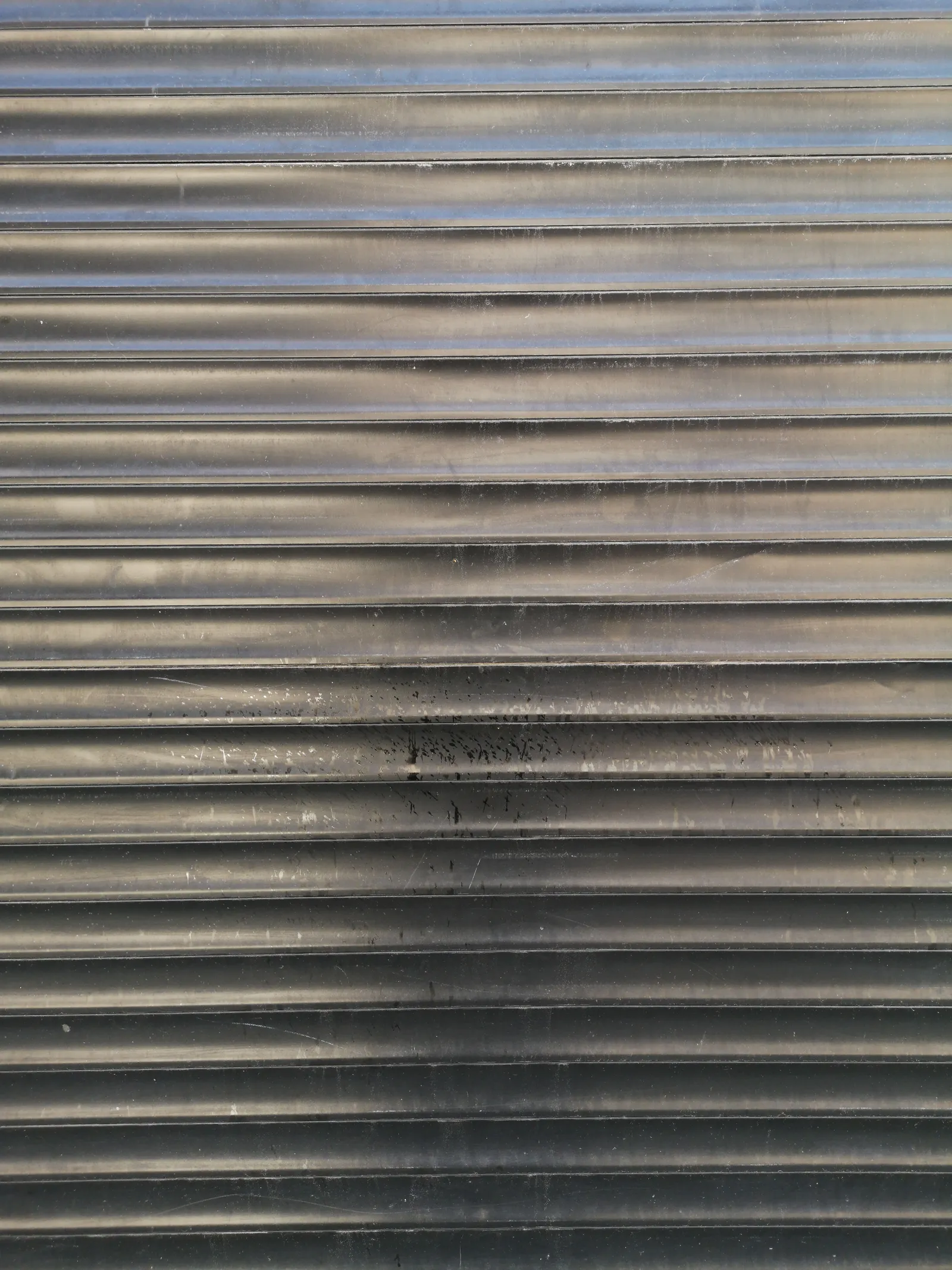Horizontal metal garage-door panels